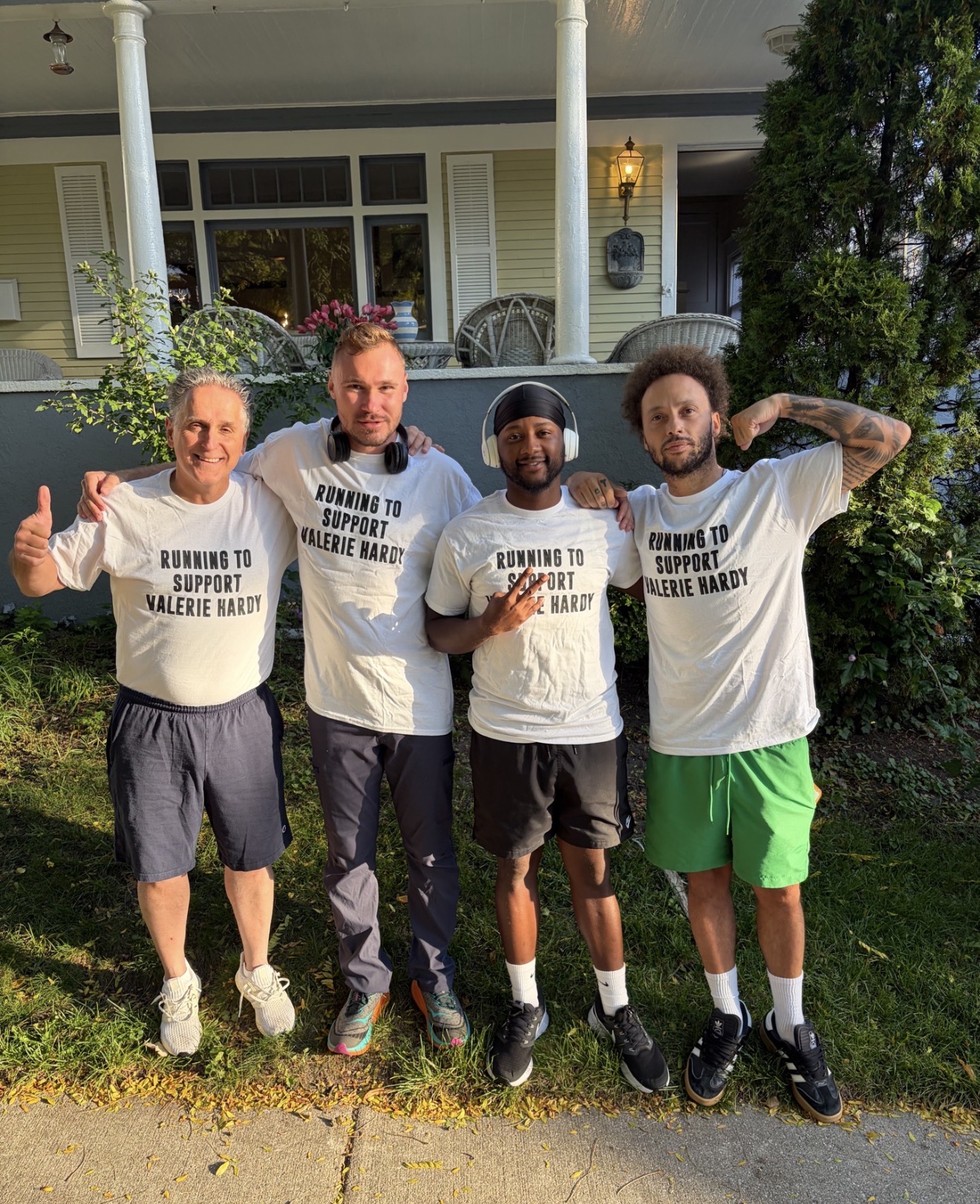 Four teammates together wearing shirts in support of Valerie Hardy
